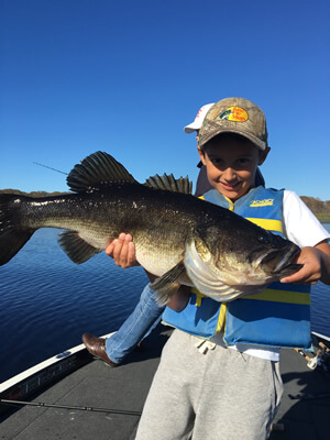 Kid with Big Bass from Kissimmee Chain of Lakes